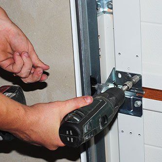 Contractor repair and replace garage door