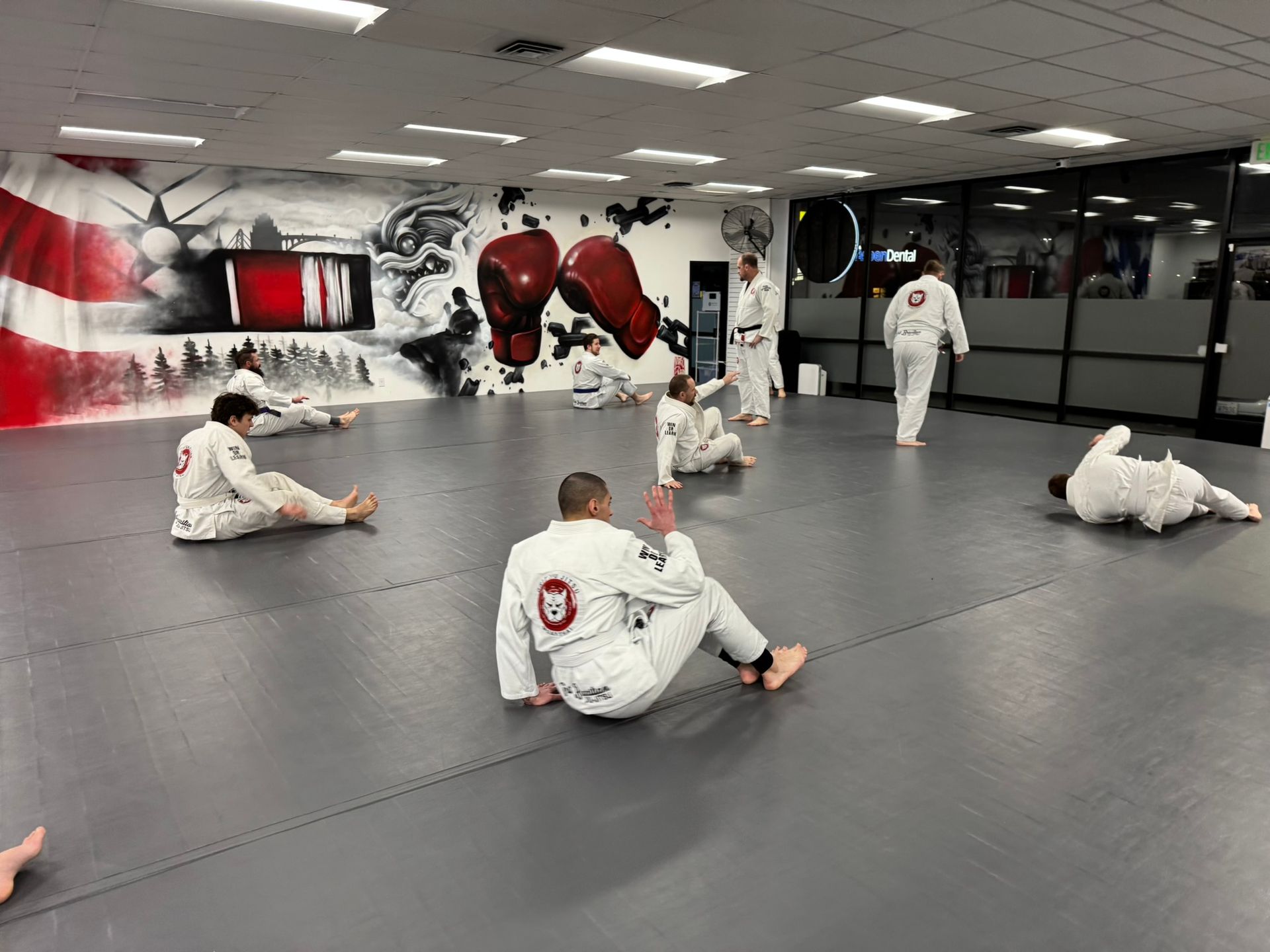 Adults drilling Jiu-Jitsu techniques at Grit Jiu-Jitsu & Muay Thai Martial Arts in Spokane Valley.