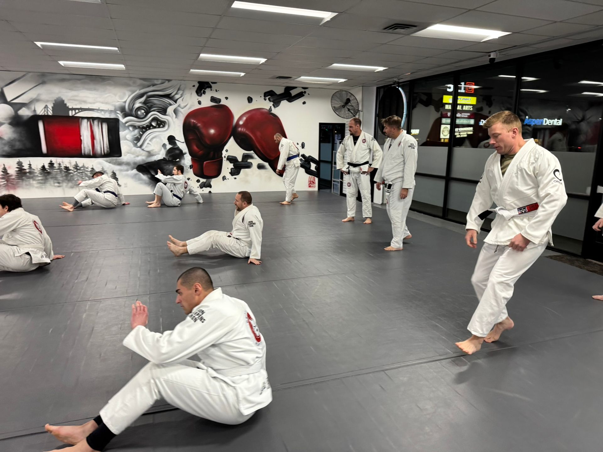 Adults practicing grappling drills at Grit Jiu-Jitsu & Muay Thai Martial Arts in Spokane Valley, WA 
