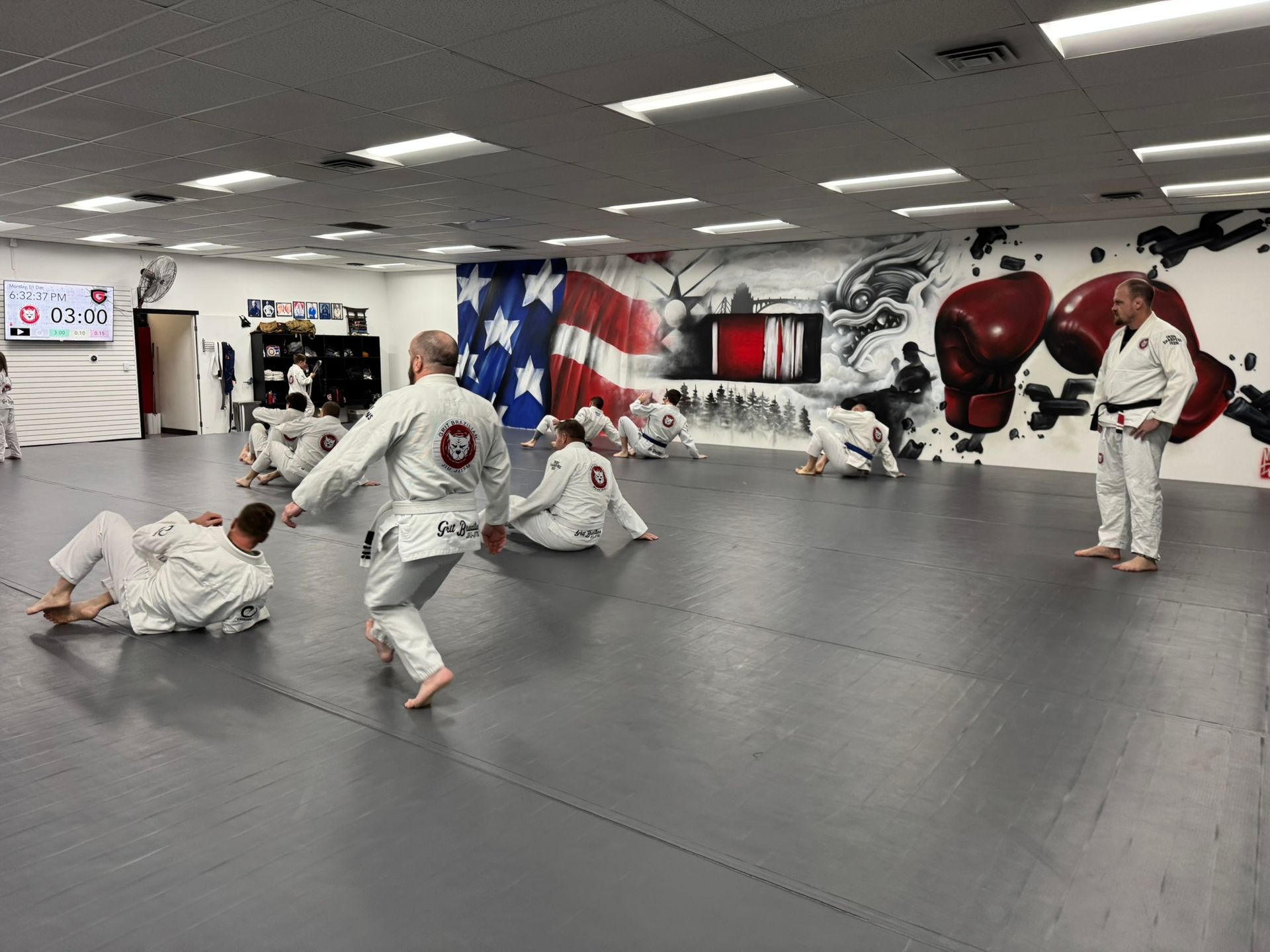 Adults practicing Jiu-Jitsu drills at Grit Jiu-Jitsu & Muay Thai Martial Arts in Spokane Valley, WA.