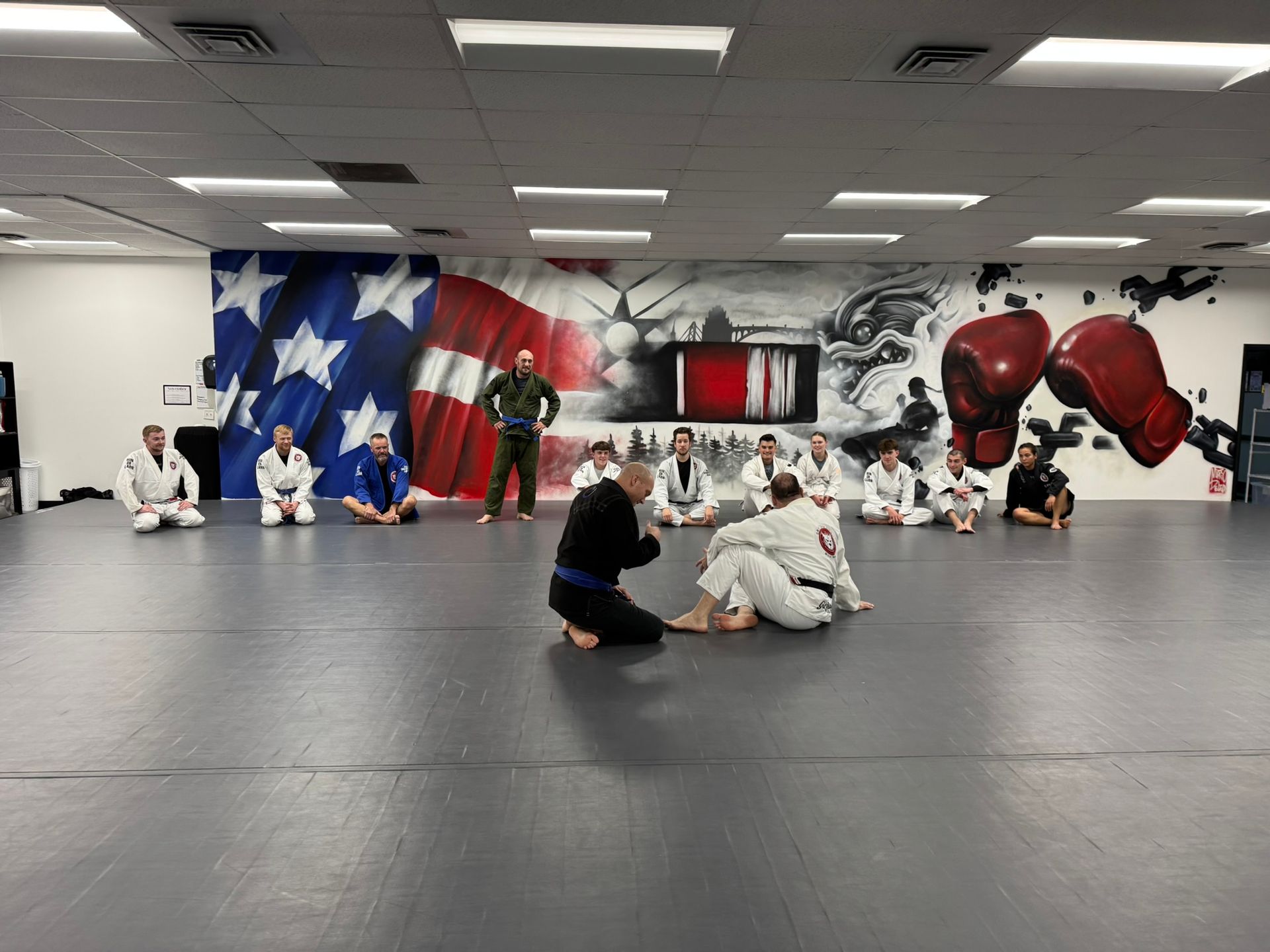 Youth students practicing safe grappling drills at Grit Jiu-Jitsu & Muay Thai Martial Arts.