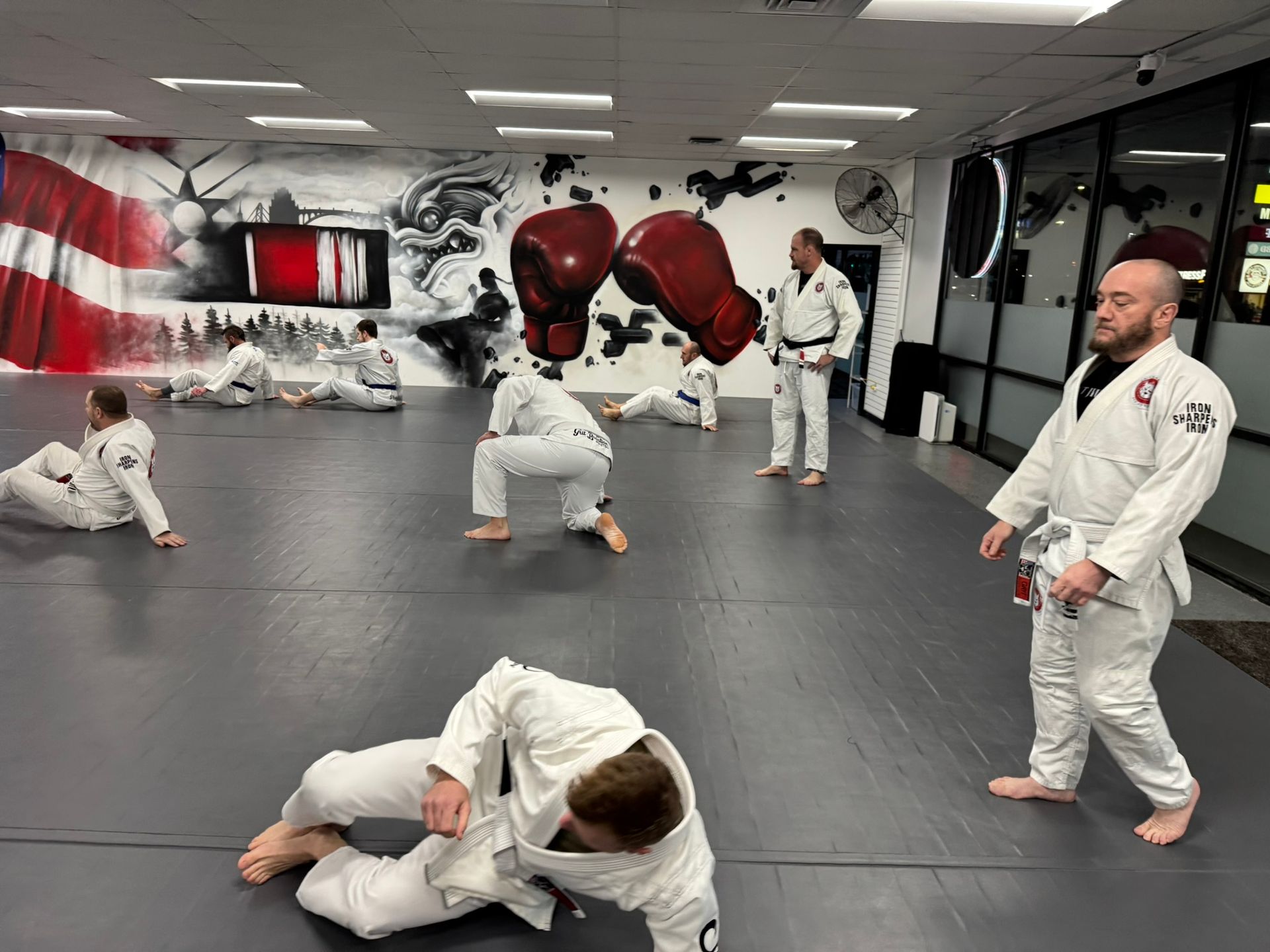 Adults practice Jiu-Jitsu sparring at Grit Jiu-Jitsu & Muay Thai Martial Arts in Spokane Valley, WA.