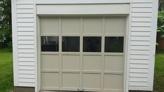 Simple Cream Colored Garage Door — Hadley, MA — Devine Overhead Doors