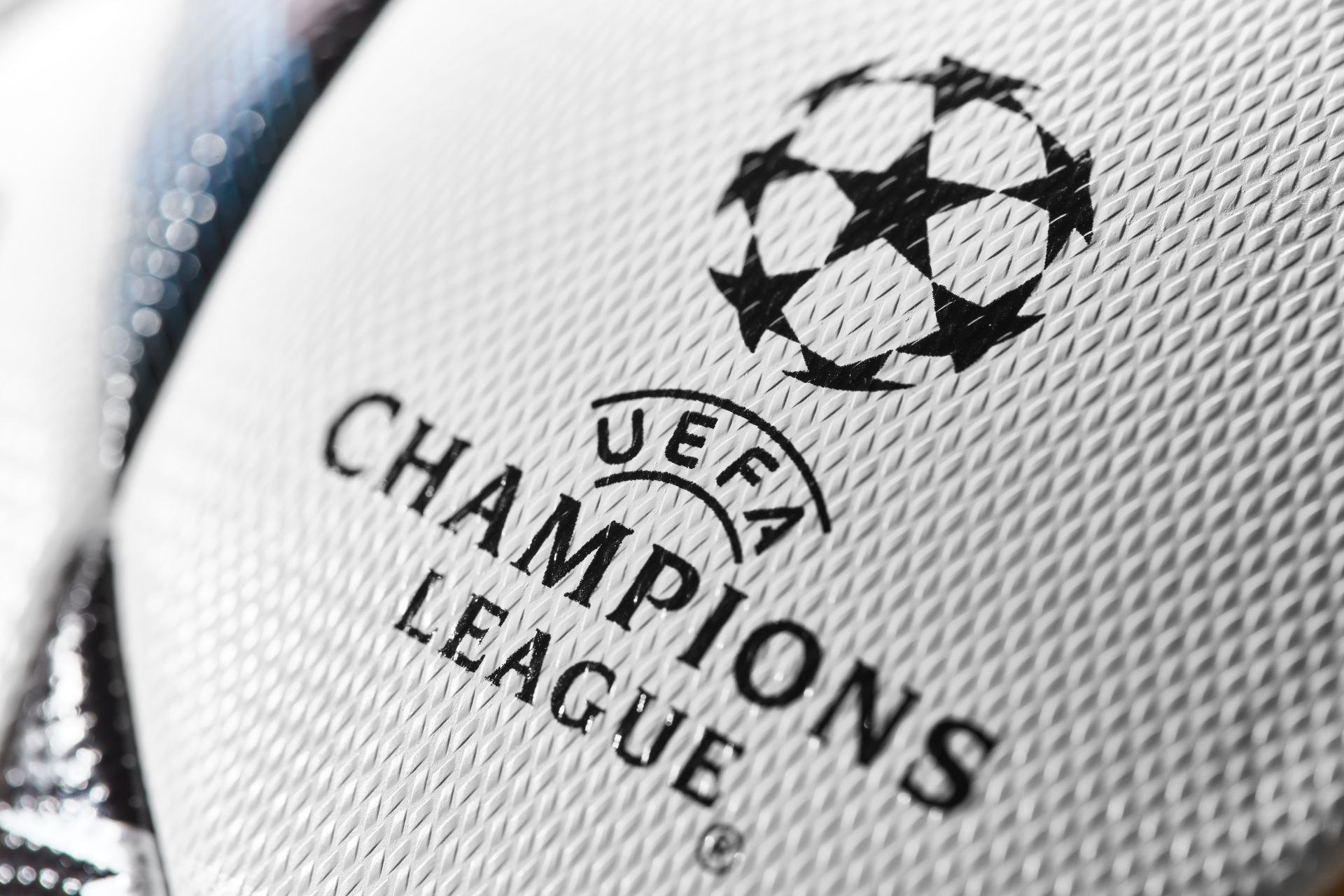 A close up of a champions league soccer ball
