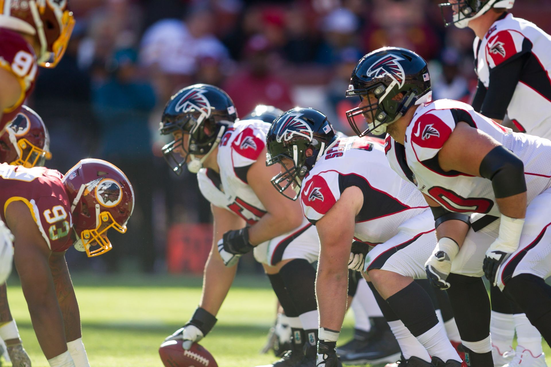 A group of football players with one wearing the number 33