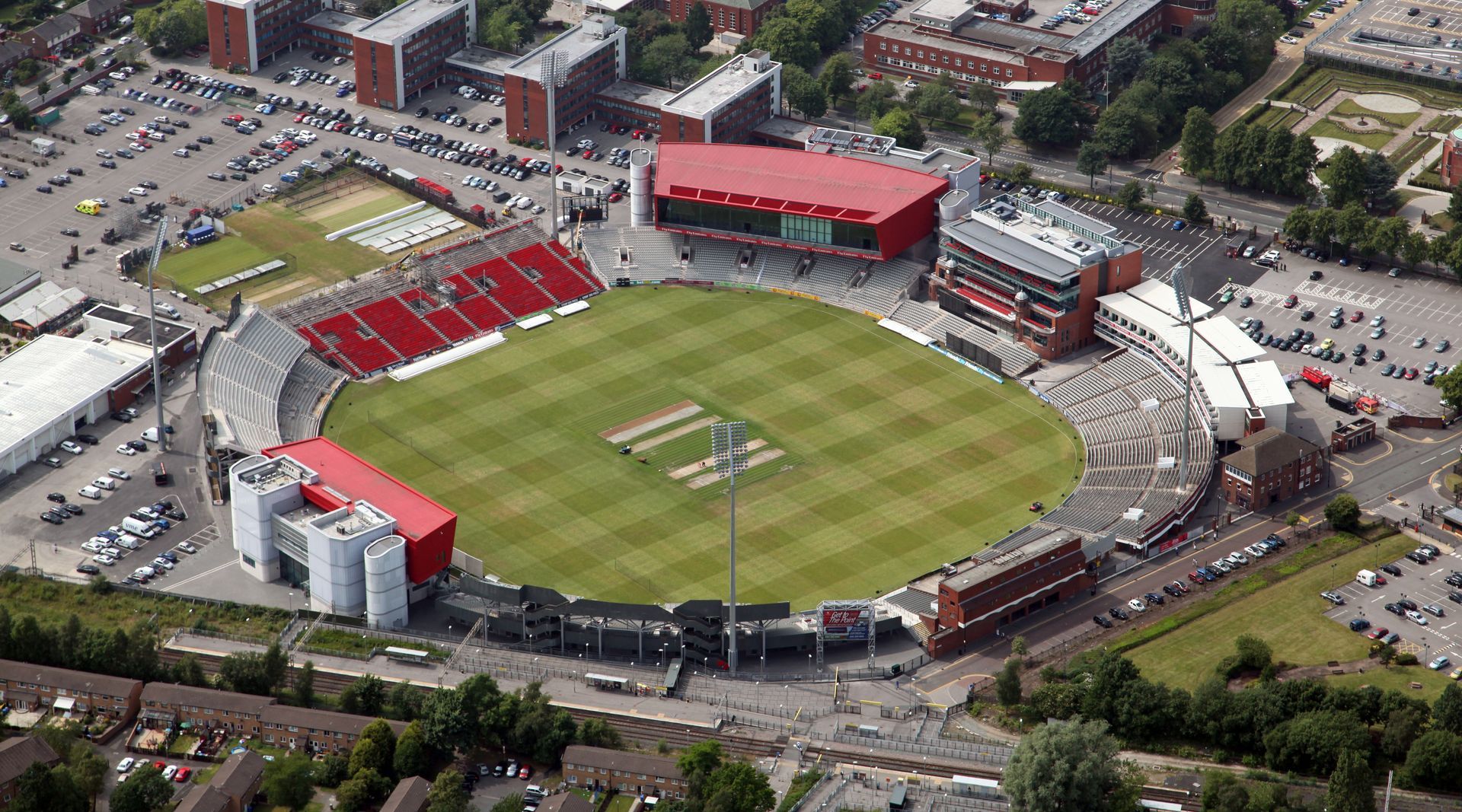 An aerial view of a cricket stadium in a city