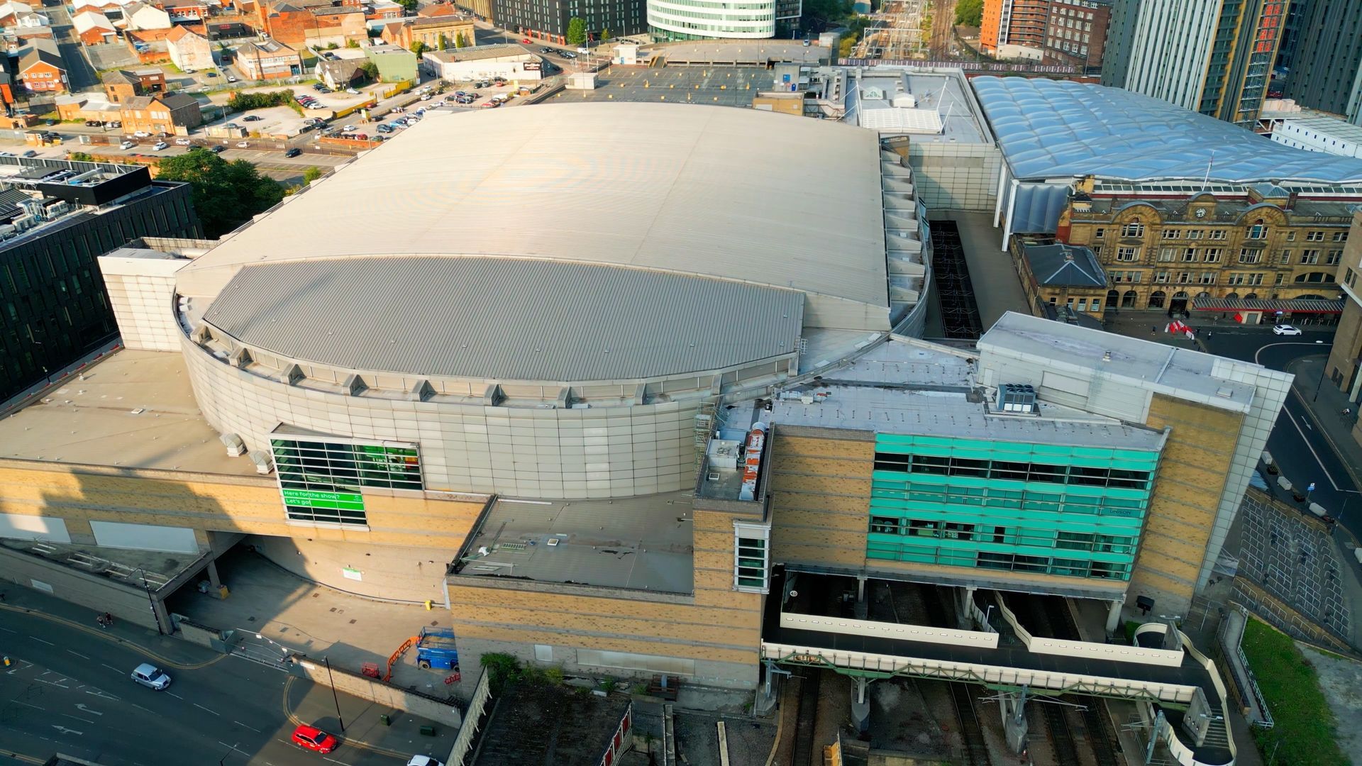 An aerial view of a large building in the middle of a city.