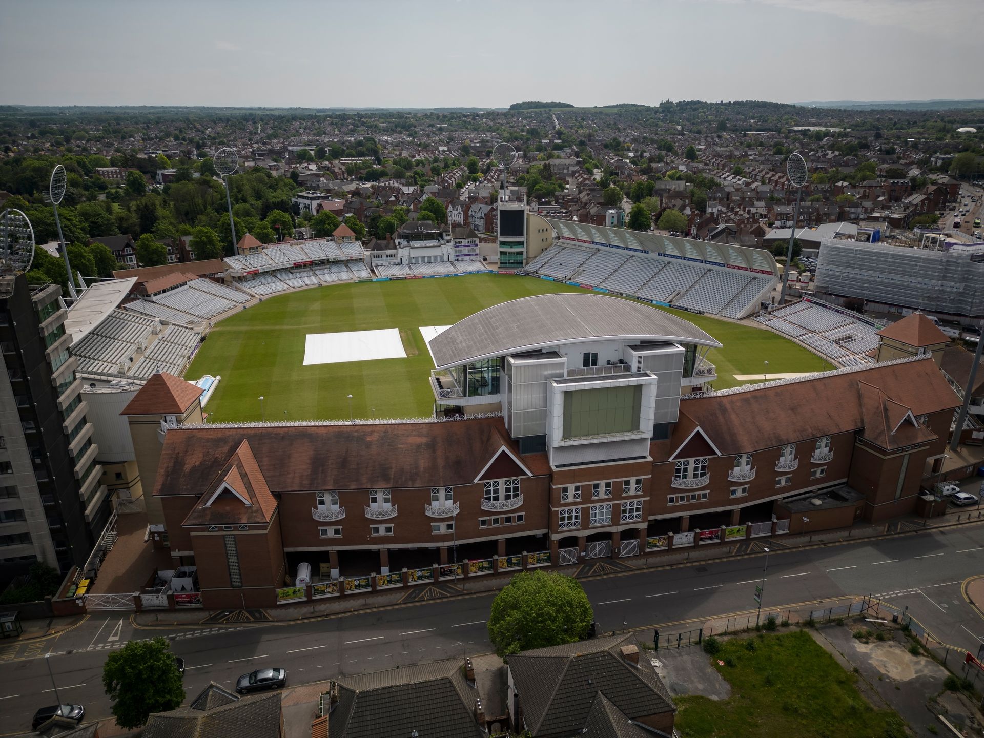 An aerial view of a cricket stadium in a city