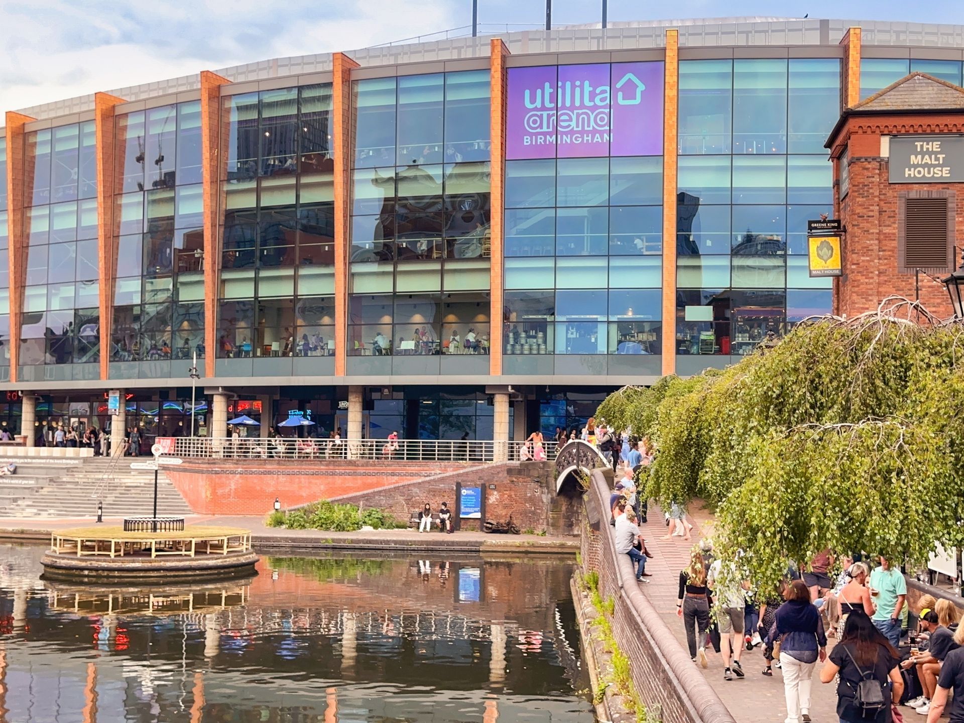 A large building with a purple sign on the side of it.