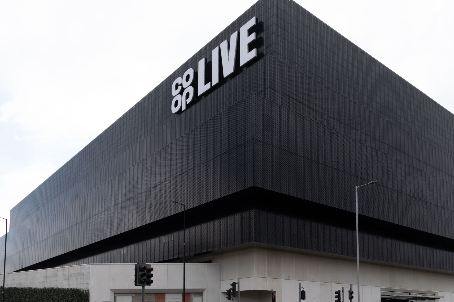 A large black building with the word live on it.