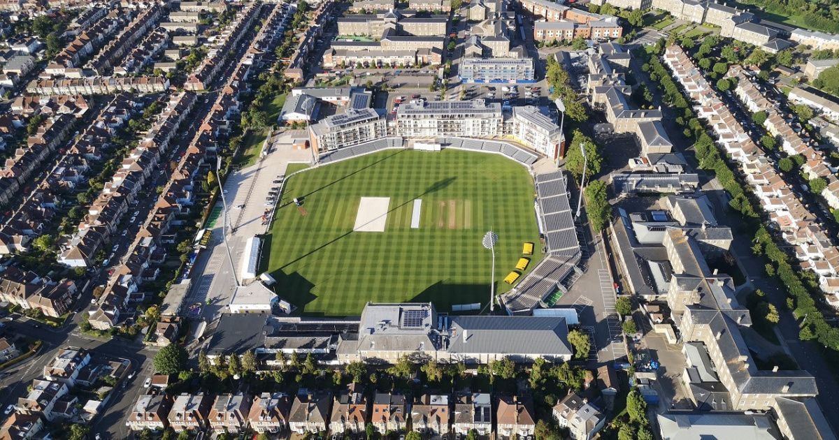 An aerial view of a cricket stadium in a city