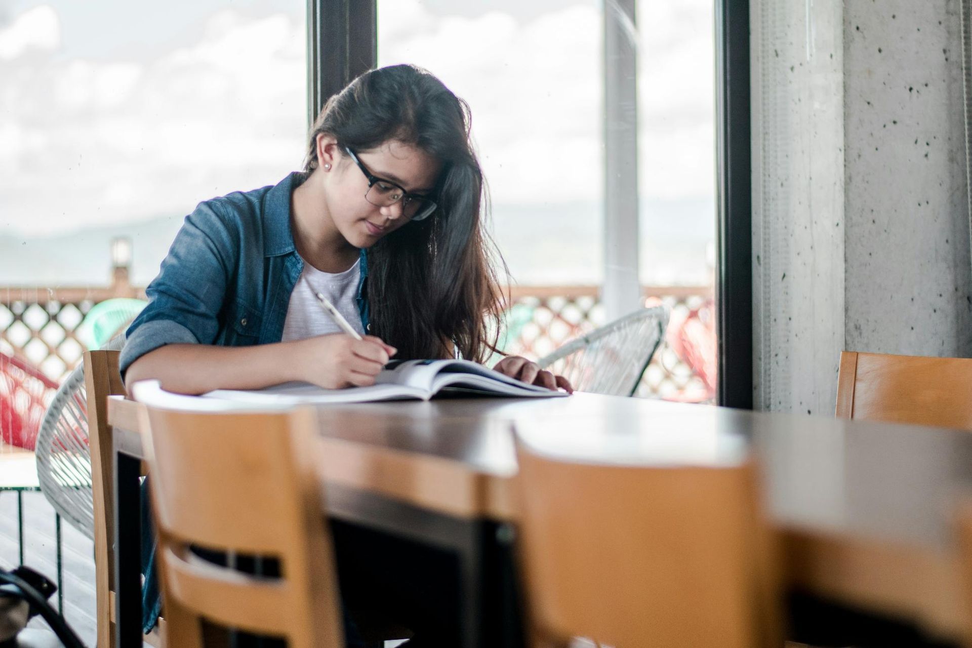 A girl writing in a notebook