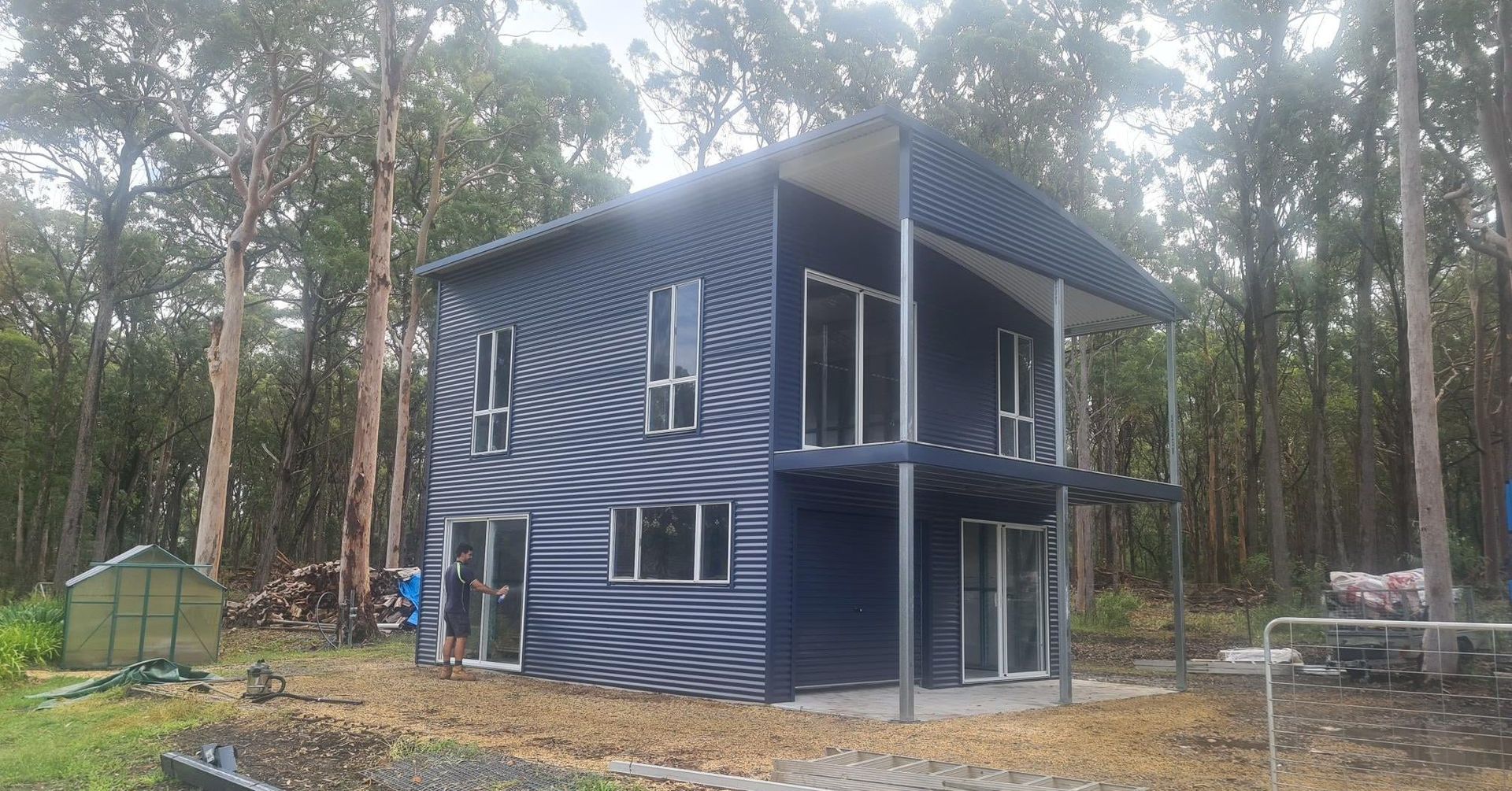 A house is being built in the middle of a forest.