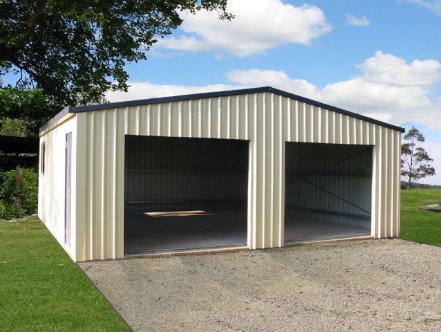 A white metal garage with two doors open