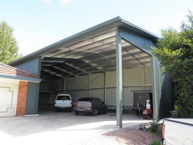 A garage with cars parked inside of it
