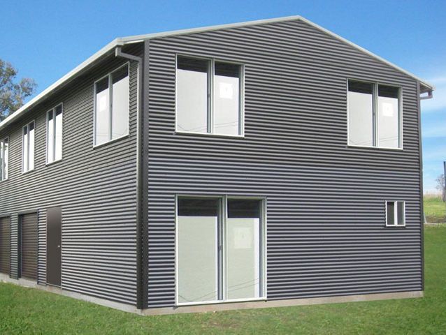 A large house with a lot of windows and doors