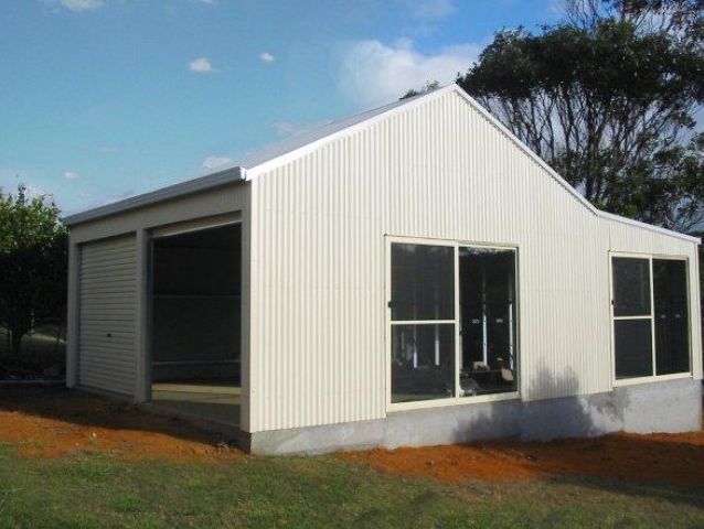 A white building with a lot of windows and doors