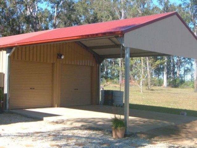 A garage with a red roof and white trim