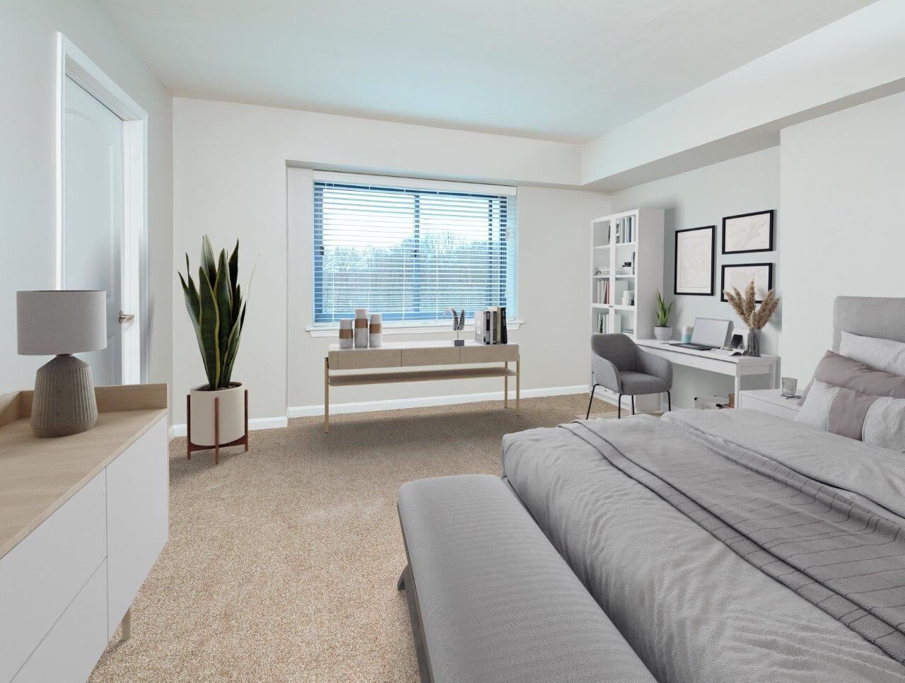 Bright modern bedroom in an apartment with a bed, desk, chair, dresser, and a large window.