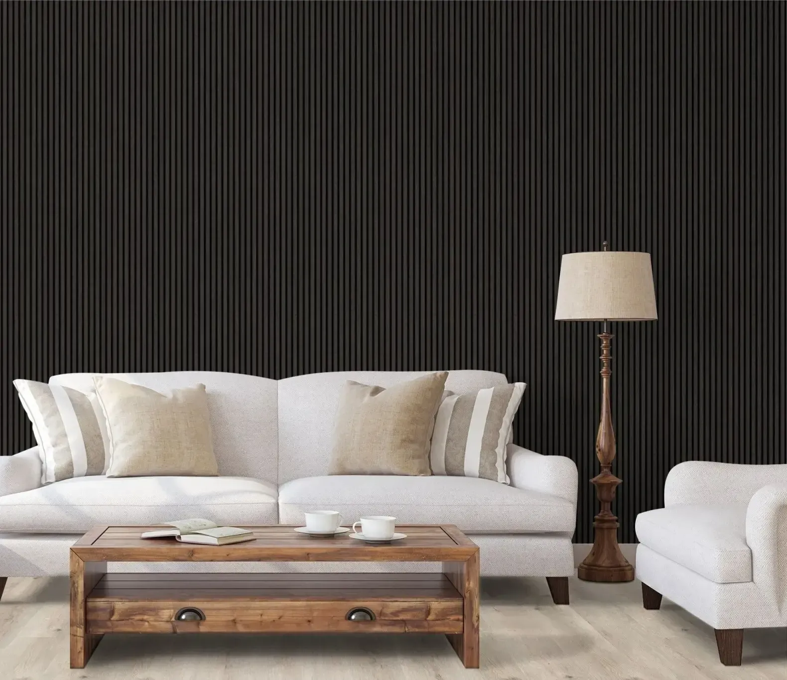 Svarta väggabsorbenter i ett vardagsrum bakom en vit soffa