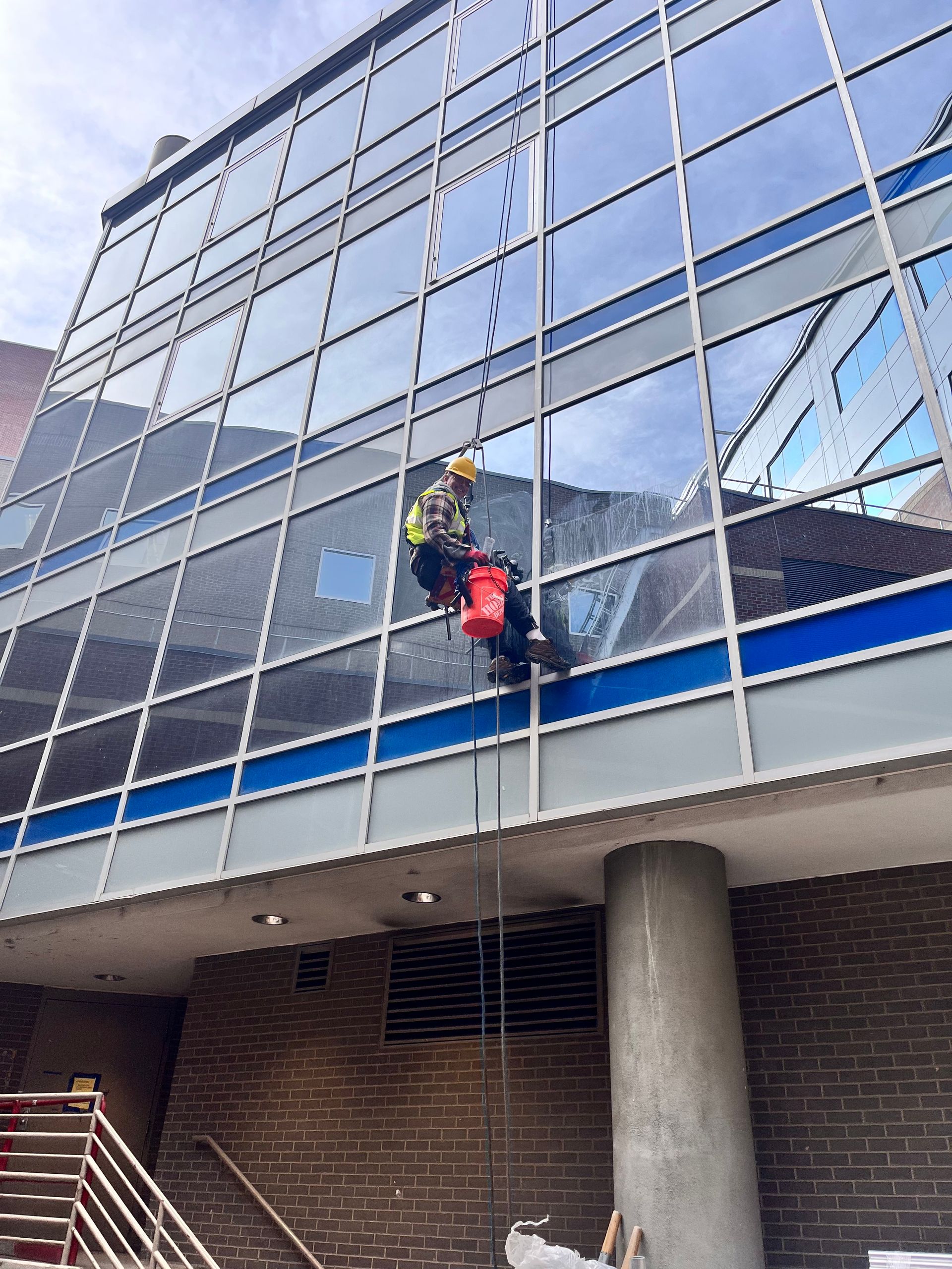 Man Cleaning Window — Denver, CO — Premier Window Cleaning & Pressure Washing