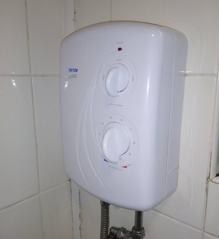 Replacement electric shower in rental property.