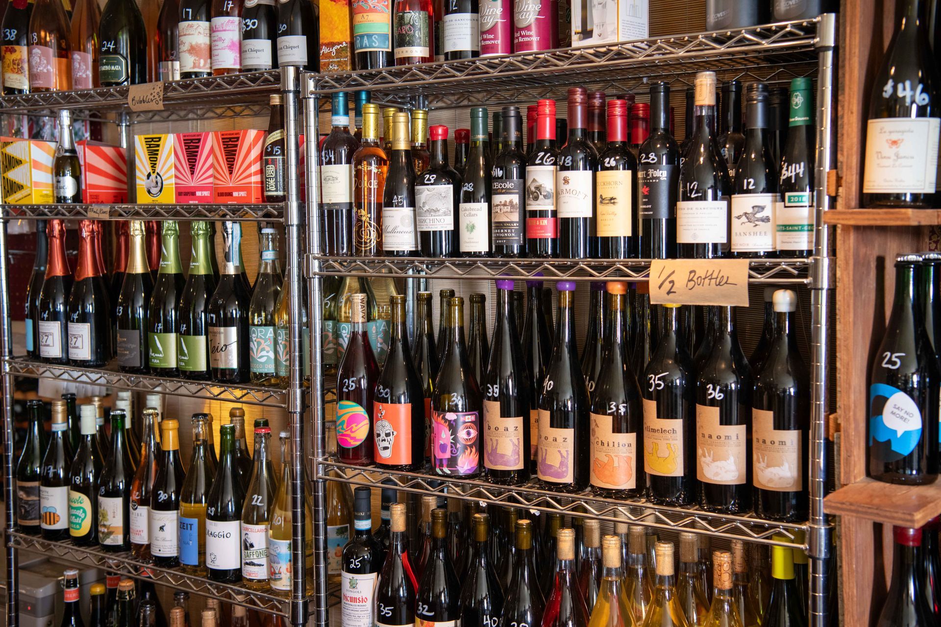 A shelf filled with lots of bottles of wine at The Wine & Cheese Depot, Ludlow, VT