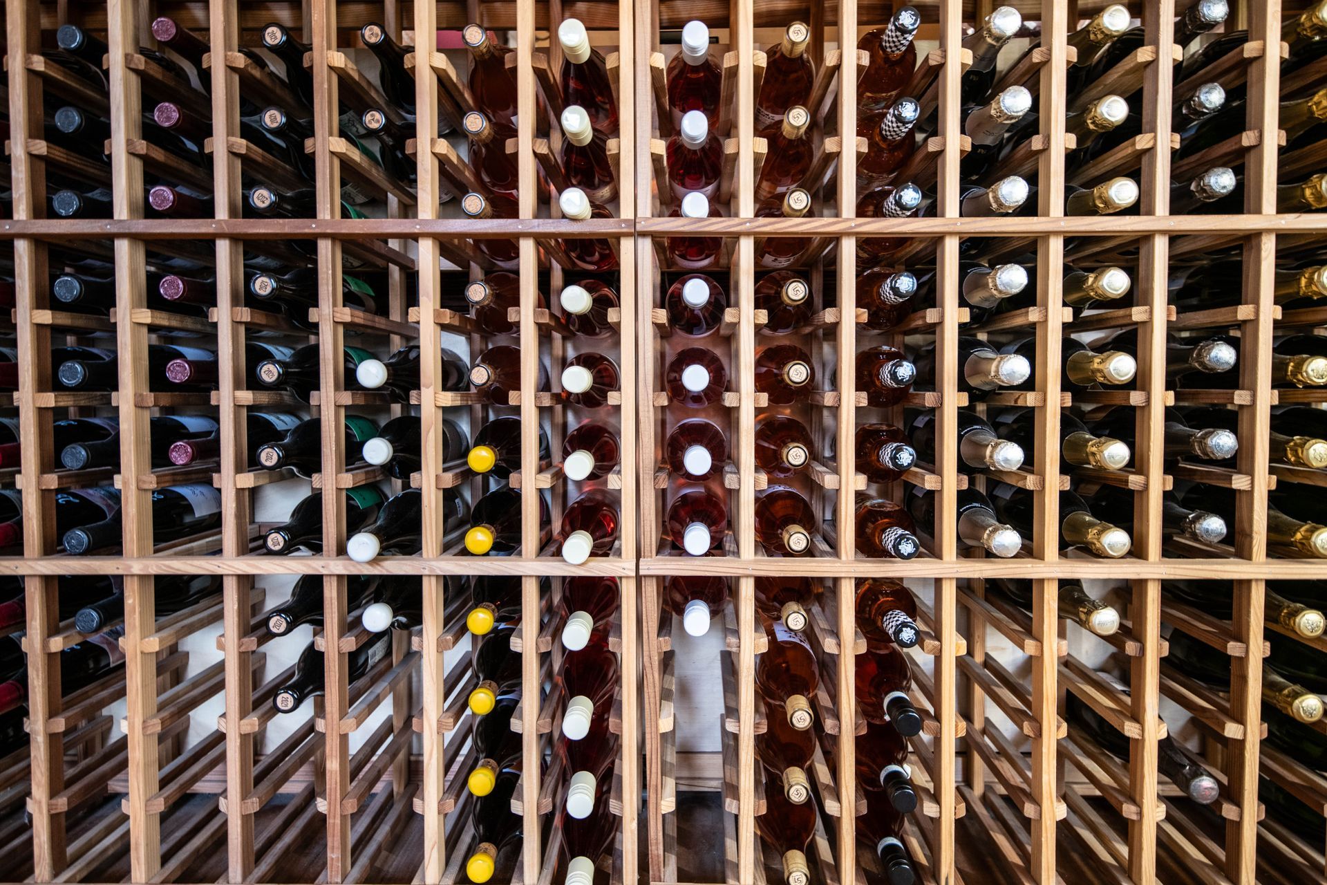 Wine & Cheese Depot wine rack filled with lots of wine bottles