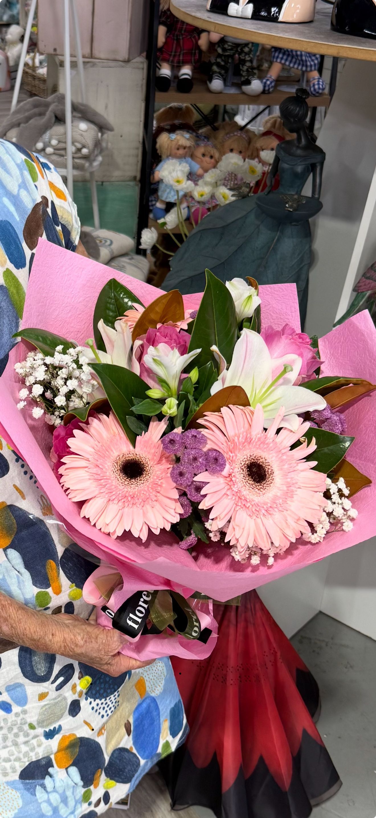 A Bunch of Red Roses Wrapped in Purple Paper — Floret In Lismore, NSW