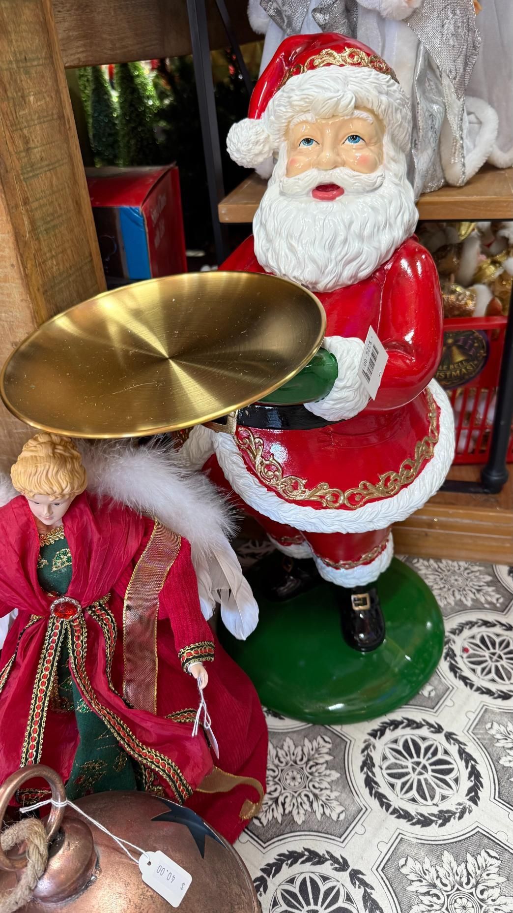Santa Claus figurine holding a gold-colored serving tray. Red suit with white trim, green base. | Jingle Bell Christmas
