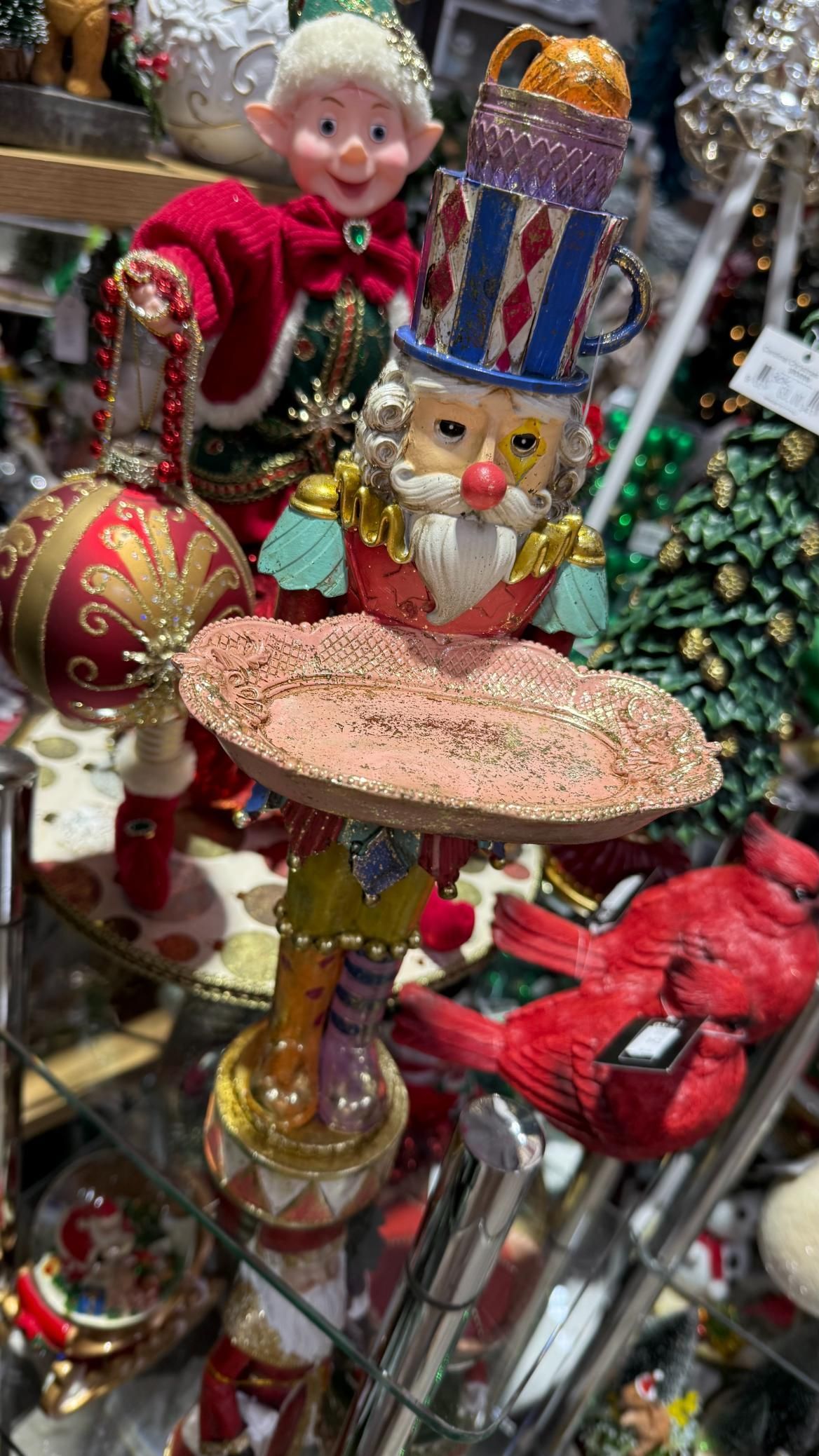 Festive Christmas ornament with elf, Santa-like figure in top hat, red cardinal, and bauble. | Jingle Bell Christmas