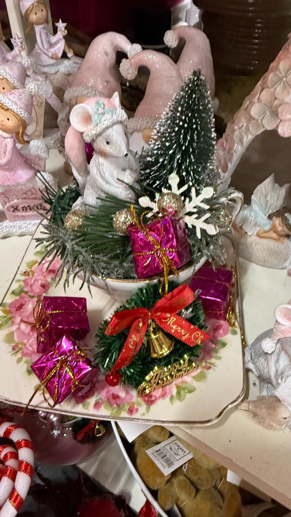 Christmas display: Mouse figurine in a teacup with presents and a small tree. Pink and green accents. | Jingle Bell Christmas