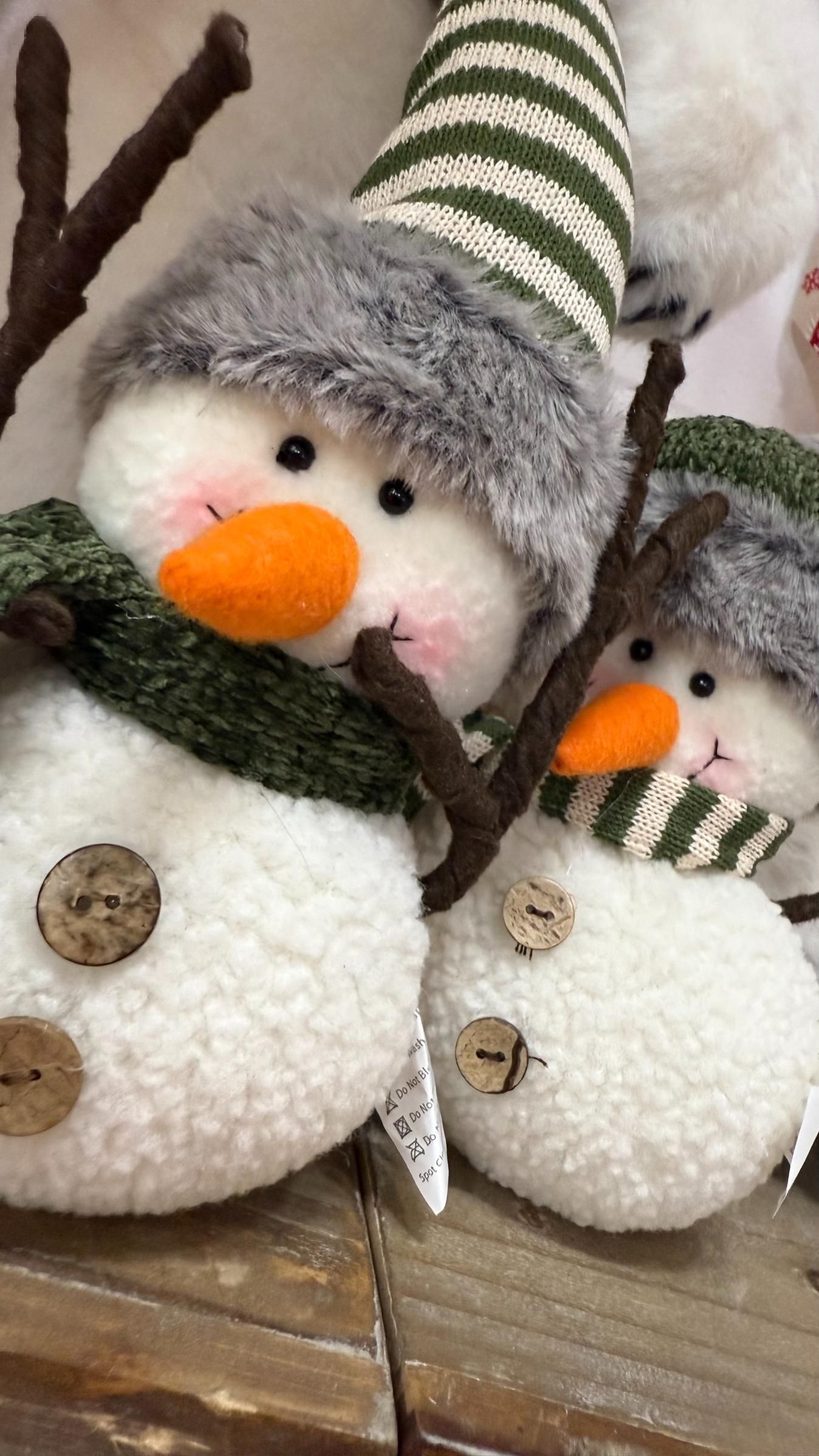 Two plush snowmen with carrot noses, wooden buttons, hats, and scarves. | Jingle Bell Christmas