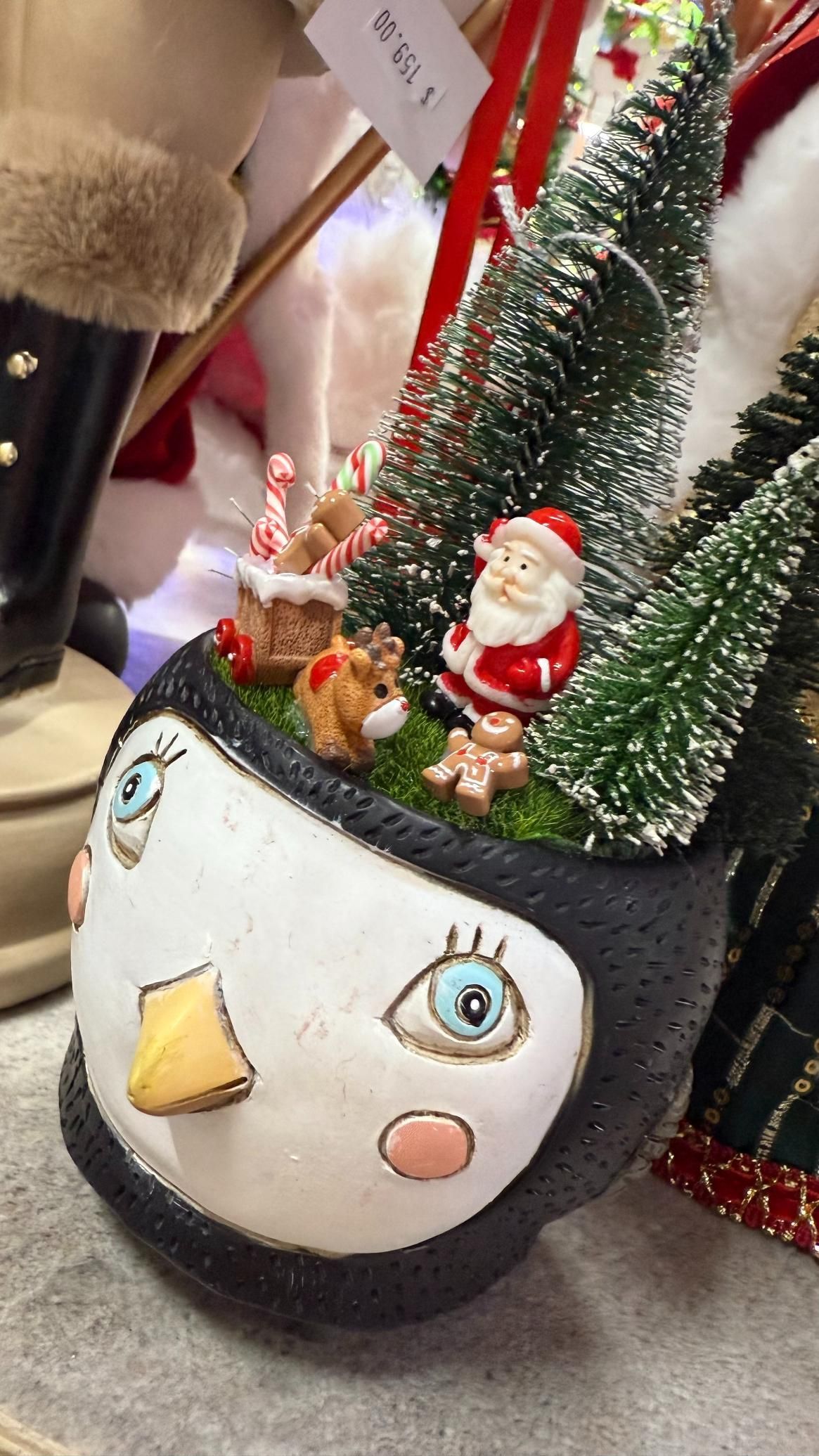 Penguin-shaped Christmas ornament with Santa, reindeer, and mini trees. | Jingle Bell Christmas