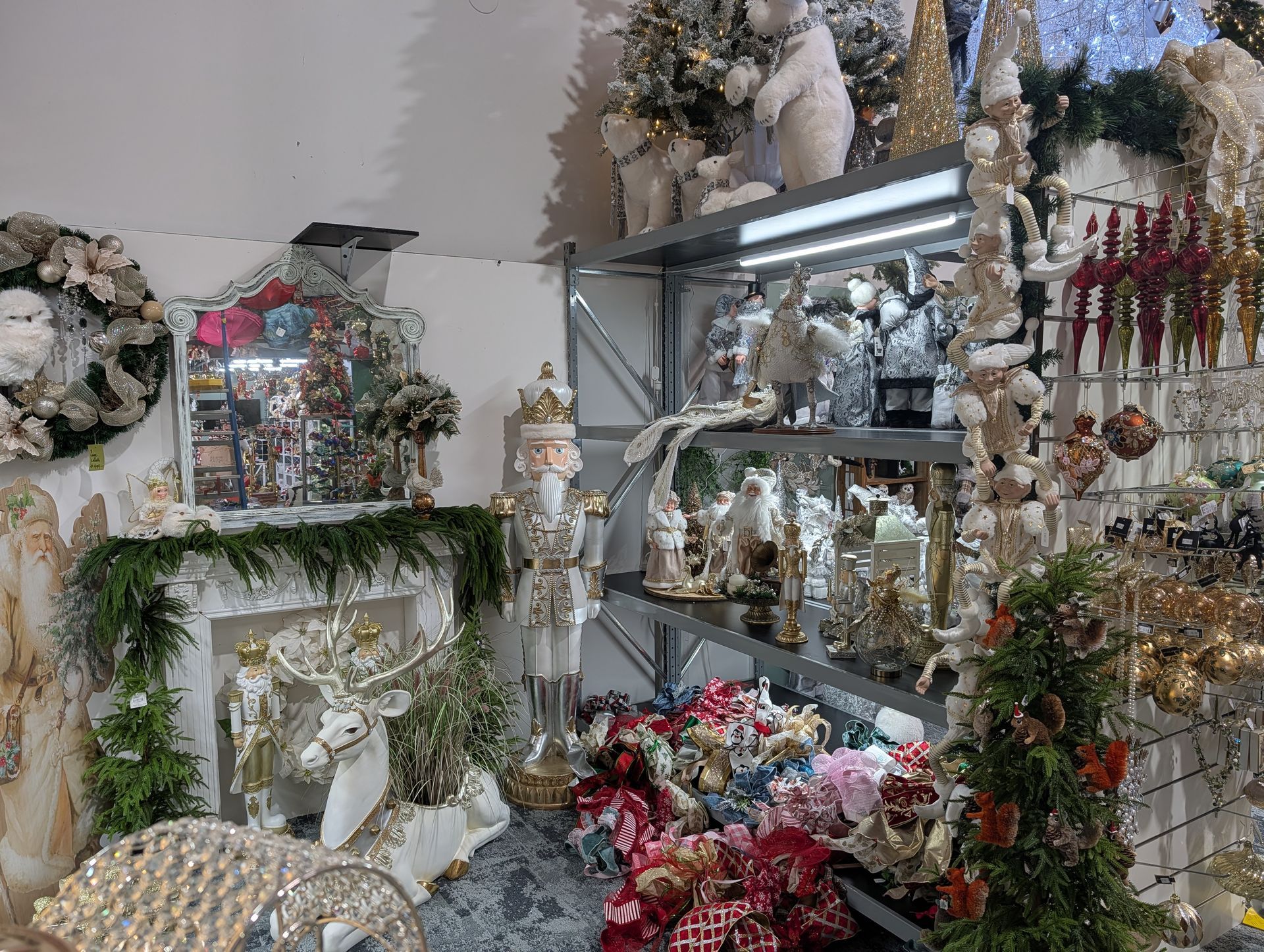 Flower Shop Display with White and Red Floral Arrangements, Wreaths, and Decorative Shelves — Jingle Bell Christmas In Casino, NSW