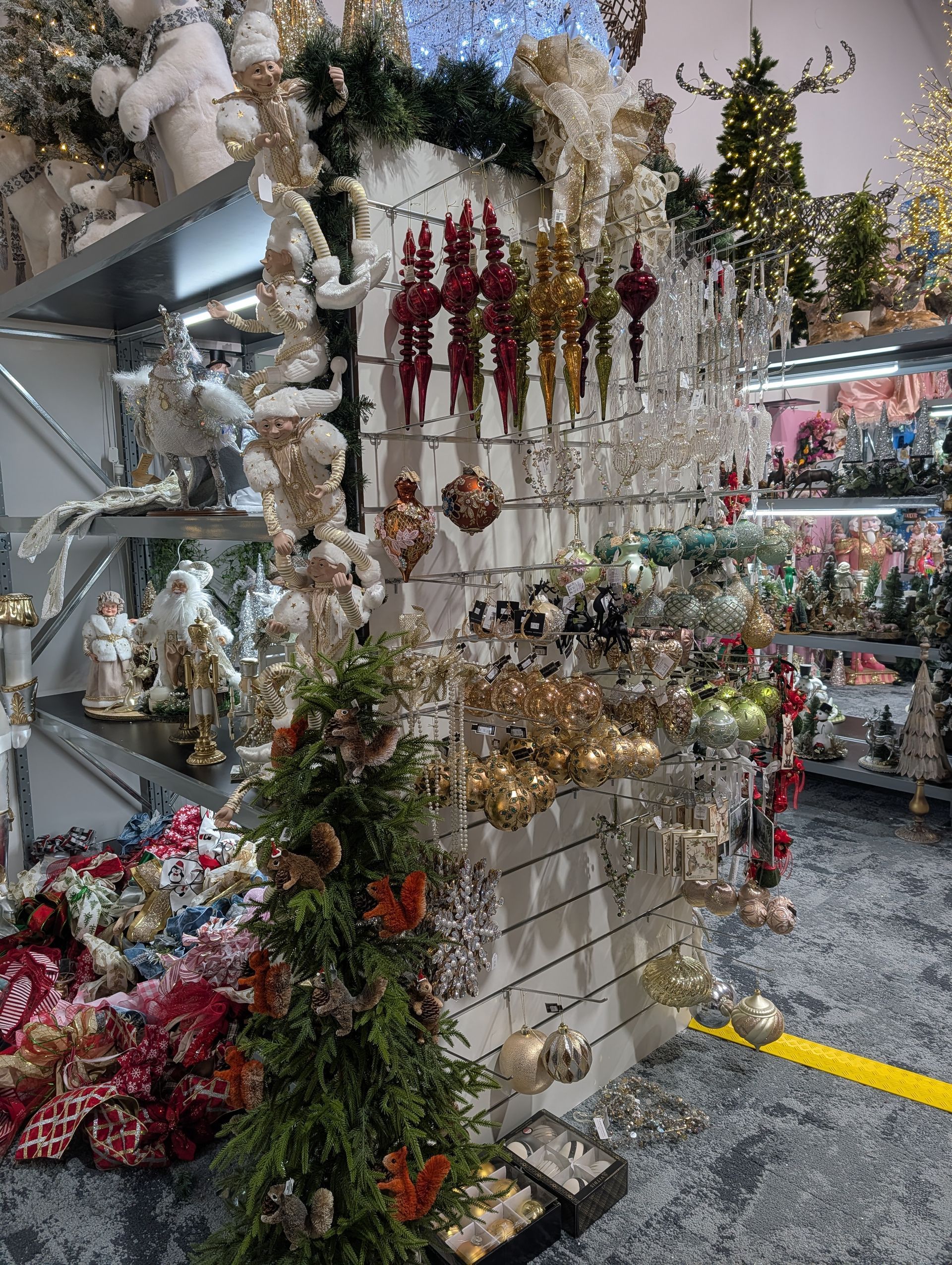 Holiday Decoration Shop Display with Tinsel, Ornaments, Wreaths, and Garlands on Shelves and Racks — Jingle Bell Christmas In Casino, NSW