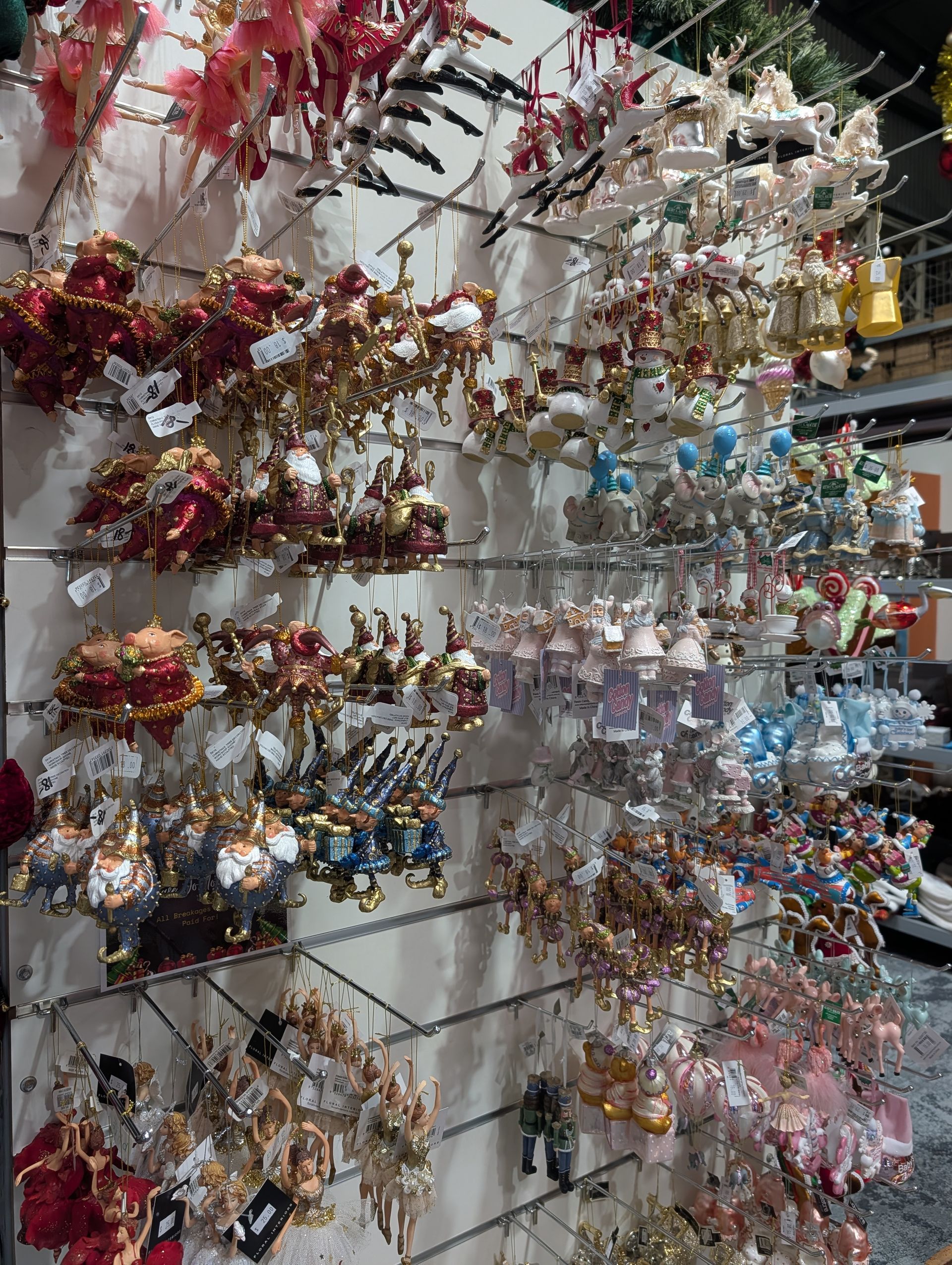 Display of Colorful Hanging Floral Ornaments and Trinkets on A Wall Rack in A Shop — Jingle Bell Christmas In Casino, NSW