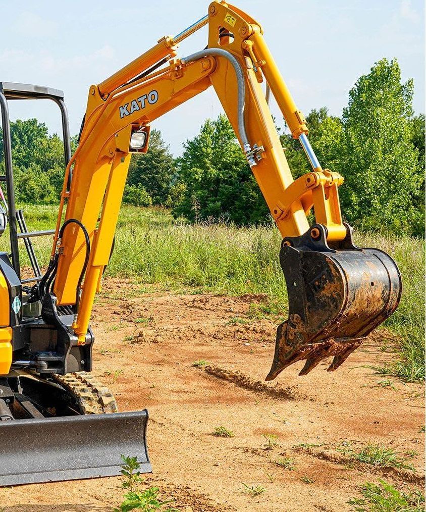 A yellow excavator with the number mb70 on it
