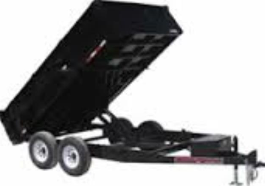 A dump trailer with the back door open on a white background.