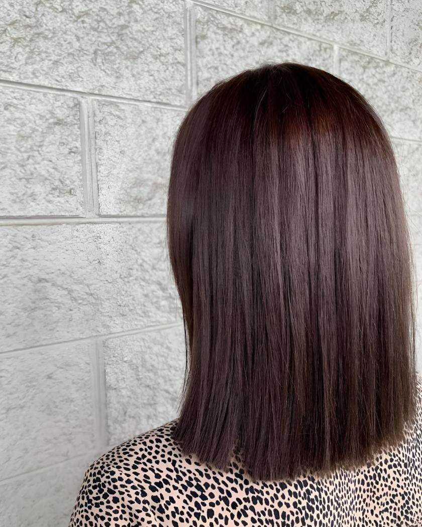 A Woman With Long Brown Hair — Beautique Hair Lounge & Beauty Bar In Condon, QLD