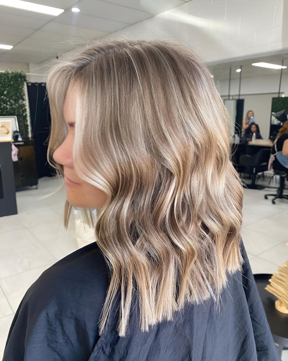 A Woman With Blonde Hair — Beautique Hair Lounge & Beauty Bar In Condon, QLD