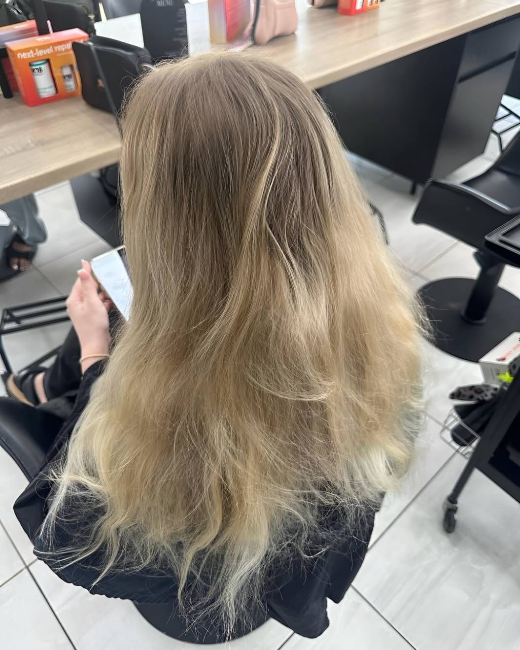 A Woman With Long Blonde Hair — Beautique Hair Lounge & Beauty Bar In Condon, QLD