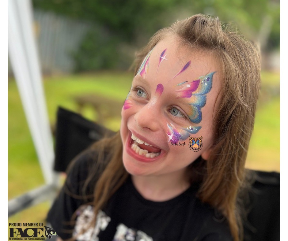 Multi colour one stroke butterfly by Paula Bargh Derbyshire face painter