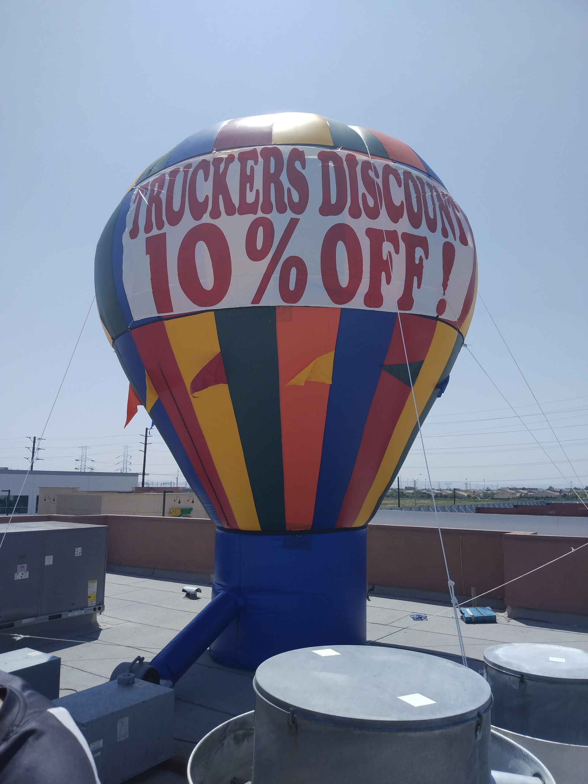 A colorful hot air balloon that says truckers discount 10 % off