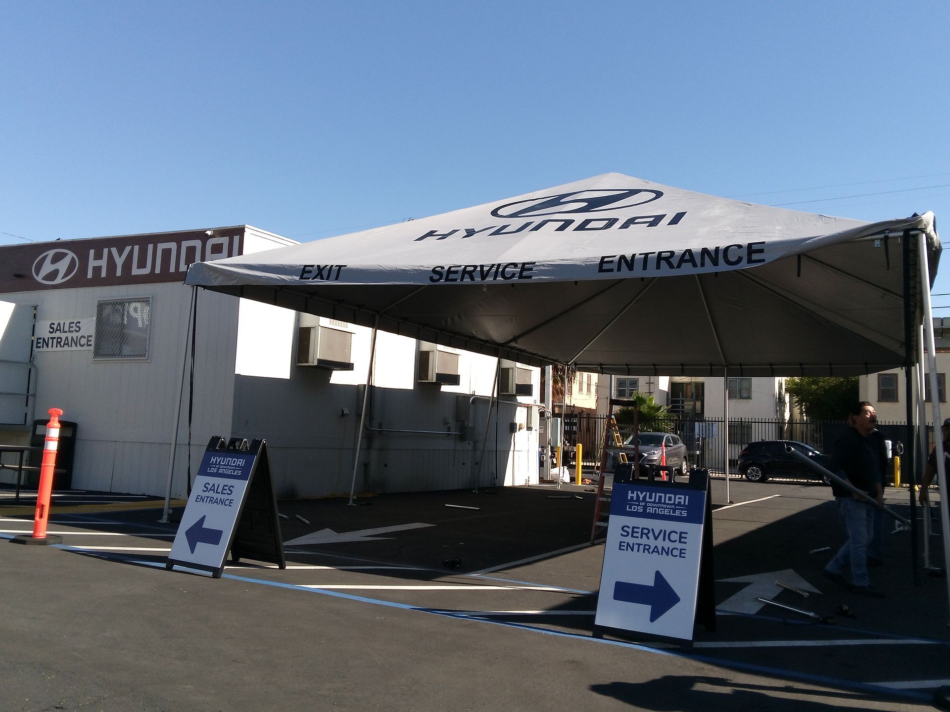 A hyundai service entrance is located under a tent