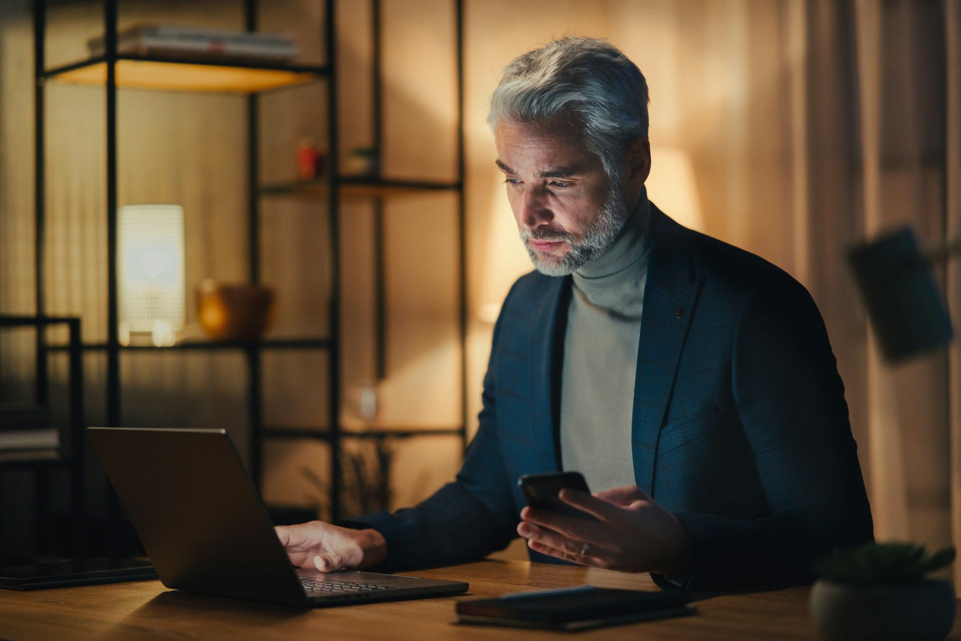 businessman looking at his laptop