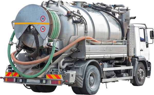 A large, silver septic truck with hoses and tanks, parked on a road.