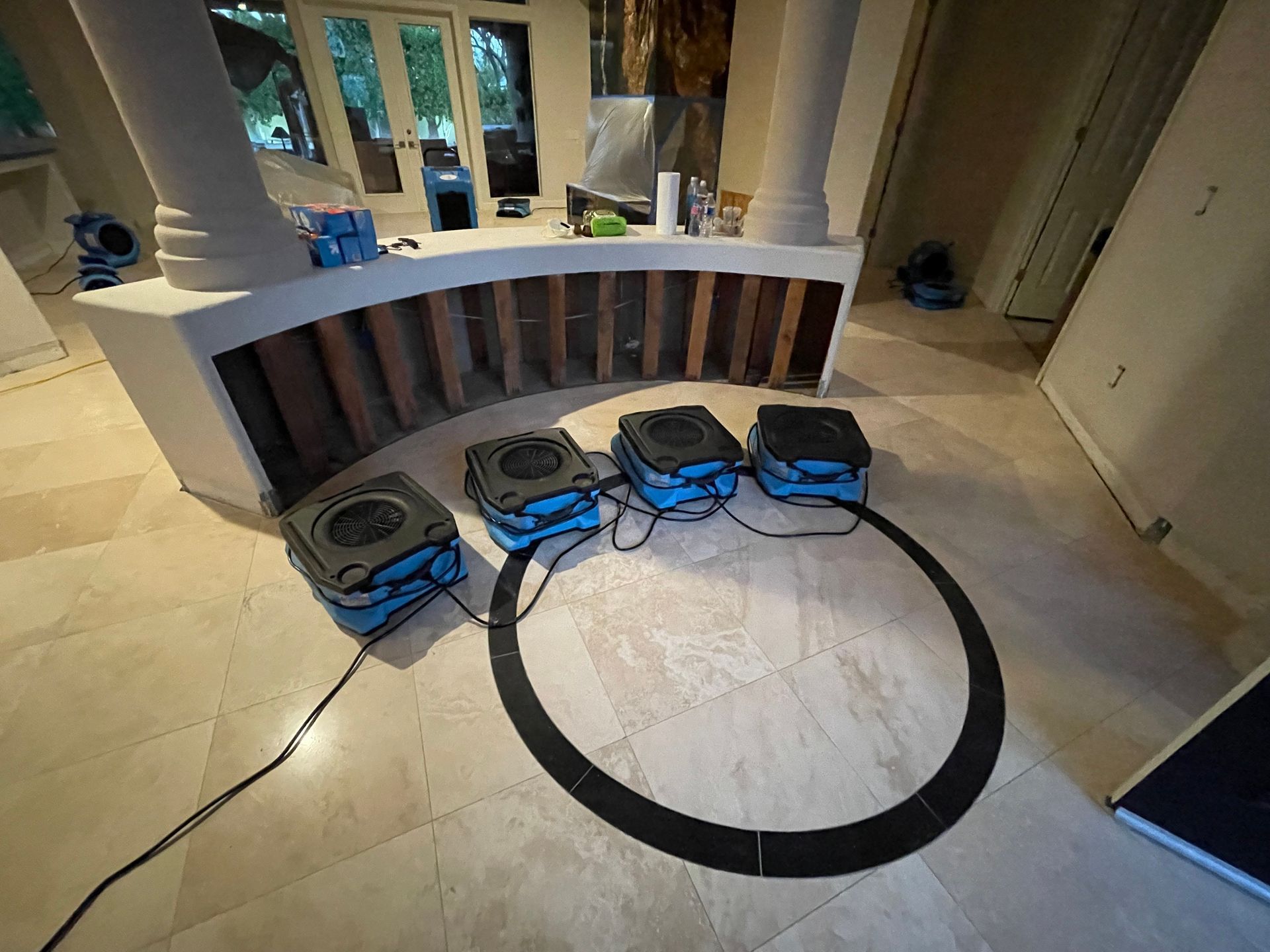 A room with a circle in the middle of it and a bunch of boxes on the floor.