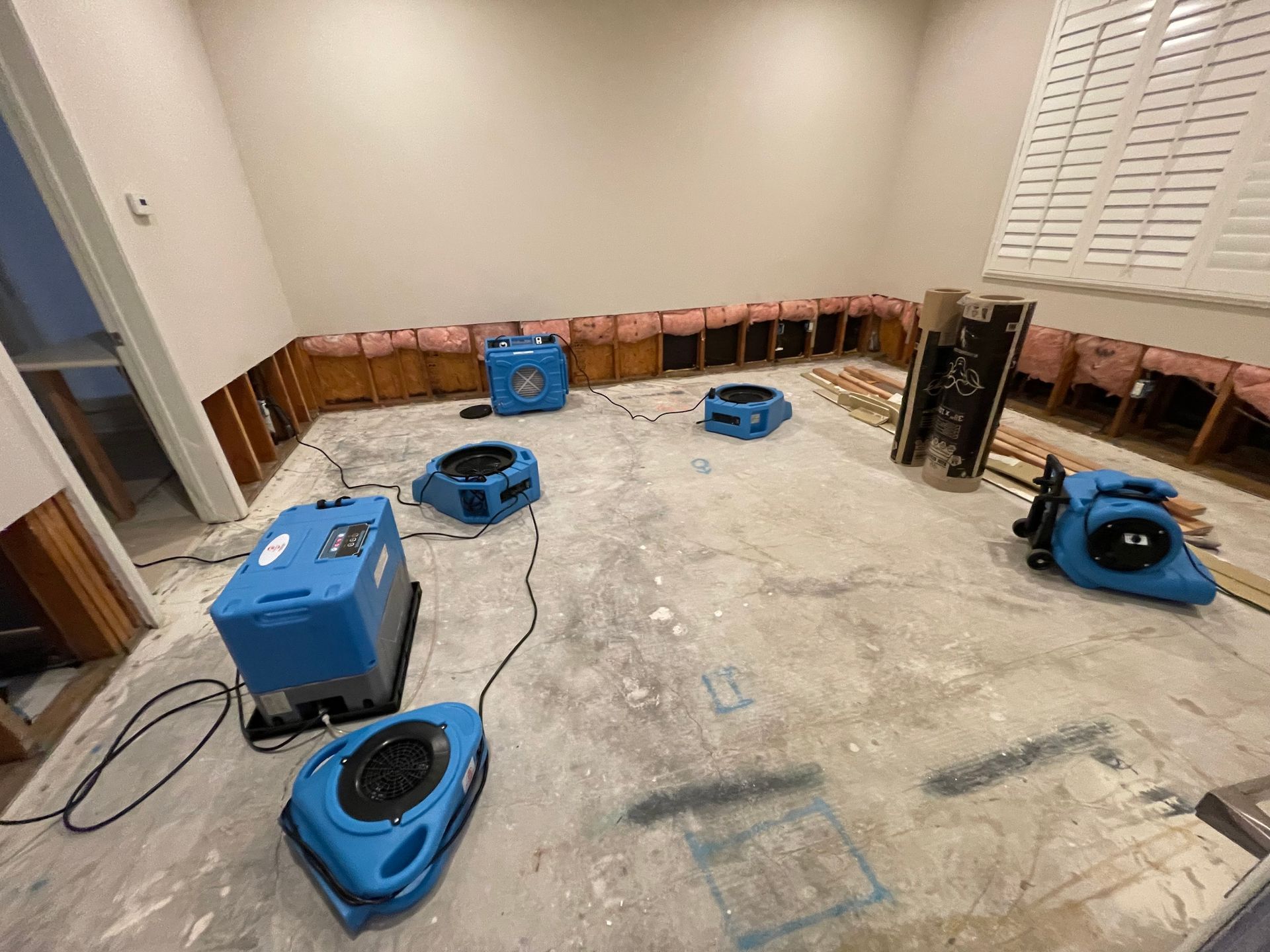 A room with a lot of fans on the floor.