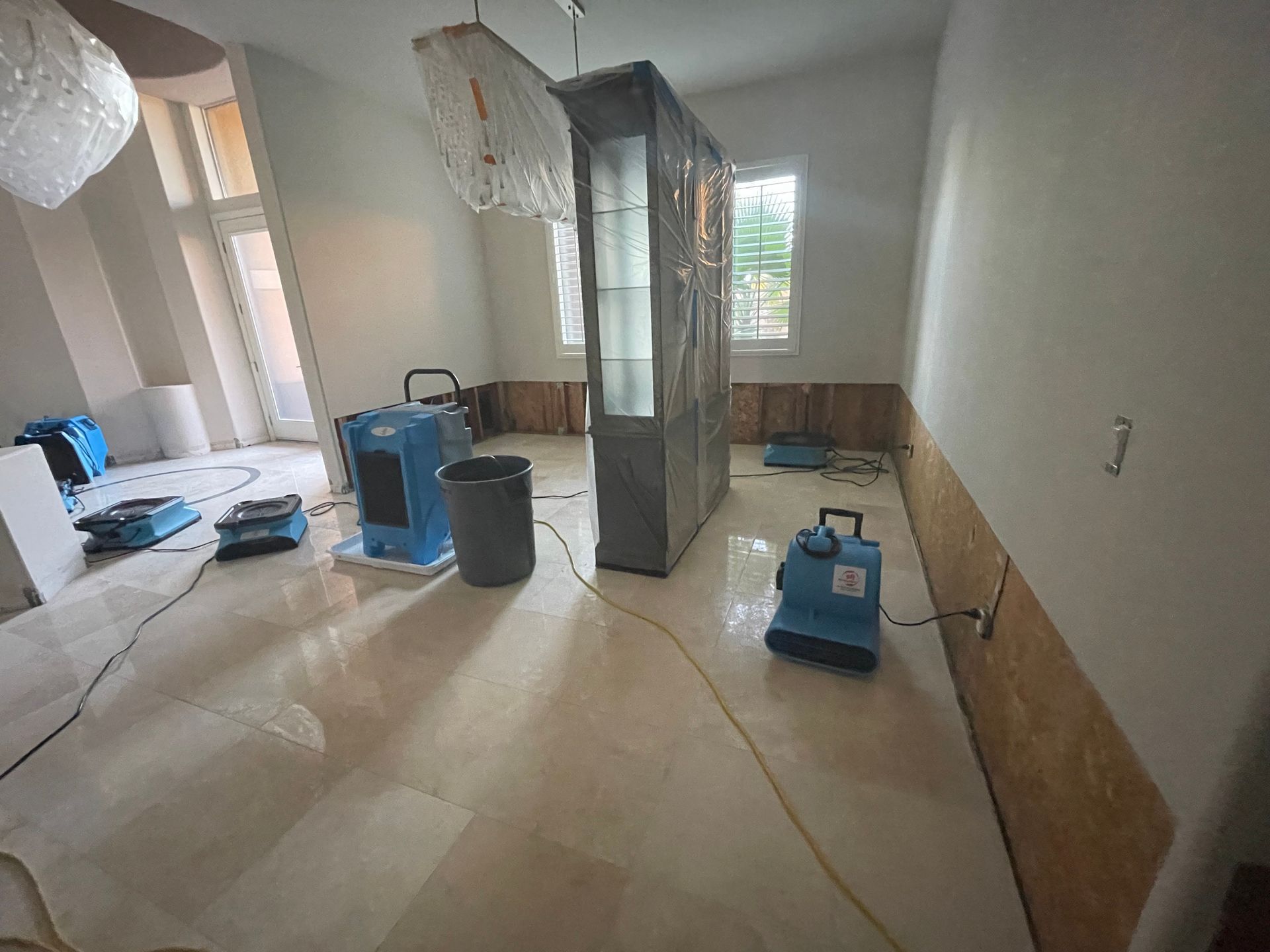 A room with a lot of appliances on the floor.